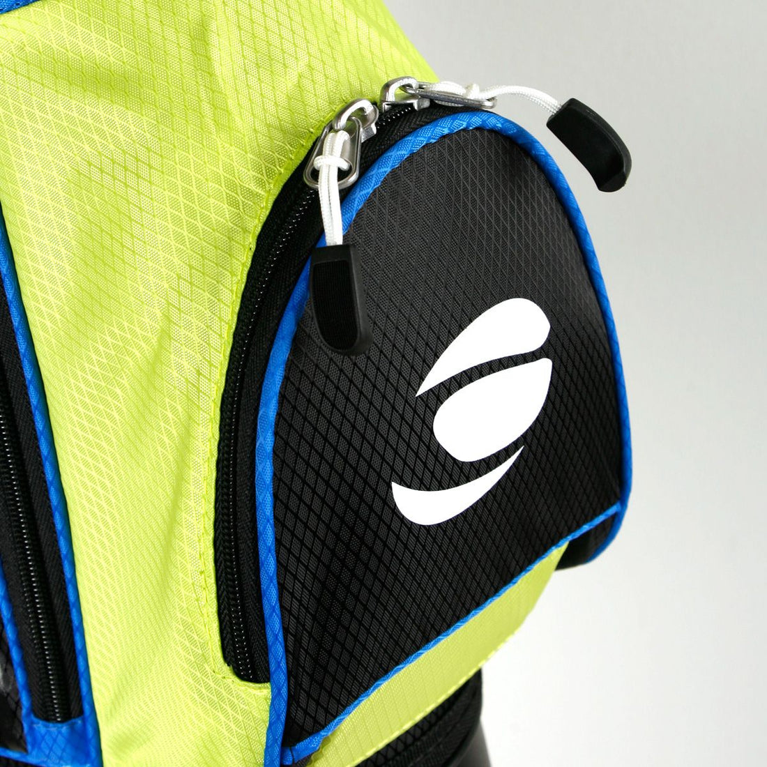 zippered front pocket on a lime green / blue Orlimar ATS Junior Golf Bag