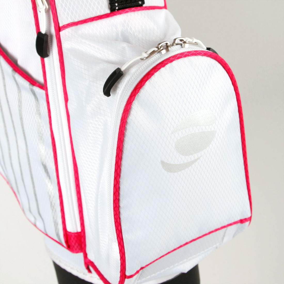 zippered front pocket on a white/pink Orlimar ATS Junior Golf Bag