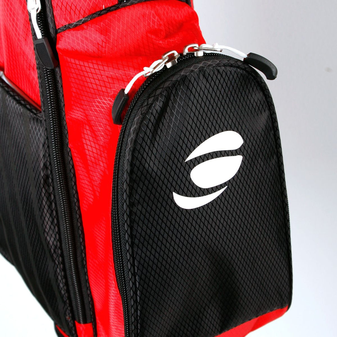 zippered front pocket on a black/red Orlimar ATS Junior Golf Bag