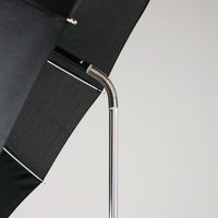 flexible spring at the top of an Orlimar Dri-Clubz Golf Bag Umbrella shaft