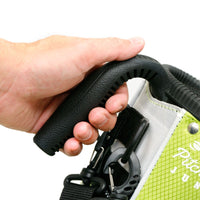 a person’s left hand holding the carry handle on a lime green Orlimar Pitch 'N Putt Junior Lightweight Stand Carry Bag