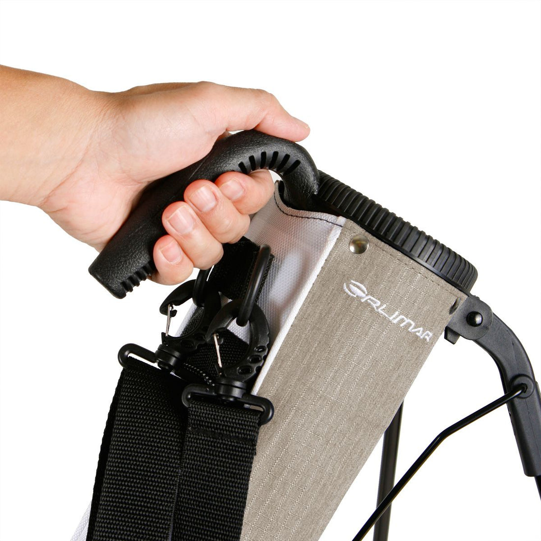 a person’s left hand holding the carry handle on a mocha brown Orlimar Pitch &