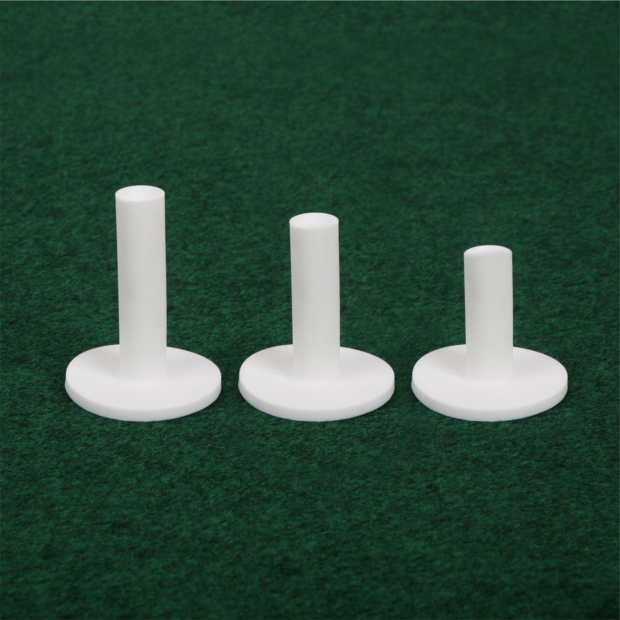 different heights of the 3 white Orlimar Rubber Driving Range Tees on green artifical carpeting