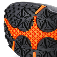up close view of the sole of a brown Orlimar Spikeless Golf Sandal