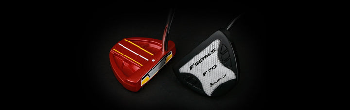 top view of a red Orlimar F70 maller putter to the left of a sole view of a black Orlimar F70 mallet putter