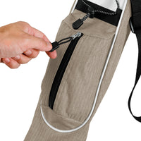 person holding the zipper of the accessories pocket of a mocha colored Orlimar Pitch 'N Putt Golf bag