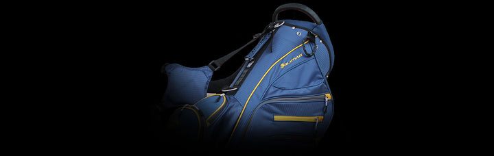 upper portion of a blue/yellow Orlimar SRX 14.9 Golf Stand Bag against a black background