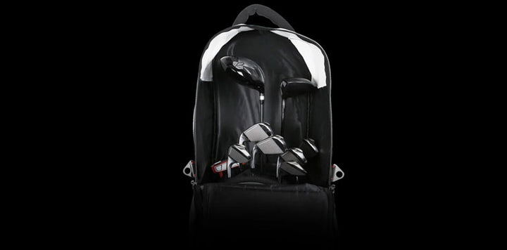 A golf bag with clubs inside the Orlimar 1680D Super Duty Deluxe Wheeled Golf Travel Cover