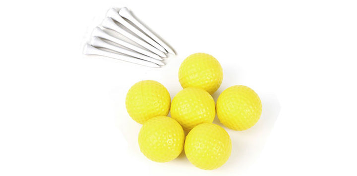 6 white golf tees laying next to 6 yellow foam practice golf balls