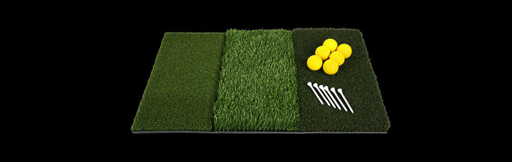 top angled view of an Orlimar Triple Surface Golf Hitting Mat with 6 yellow foam practice golf balls and 6 white golf tees against a black background