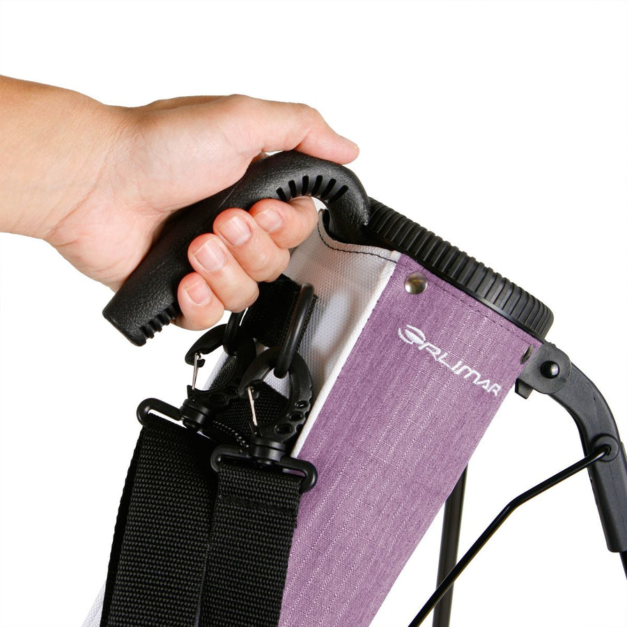 a person’s left hand holding the carry handle on a lilac purple Orlimar Pitch 'N Putt Lightweight Stand Carry Bag