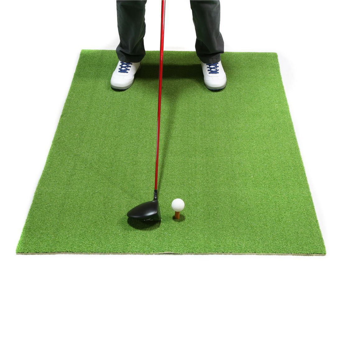 front angled view of a person getting ready to hit a driver off an Orlimar Residential Golf Mat with white golf ball on the rubber tee