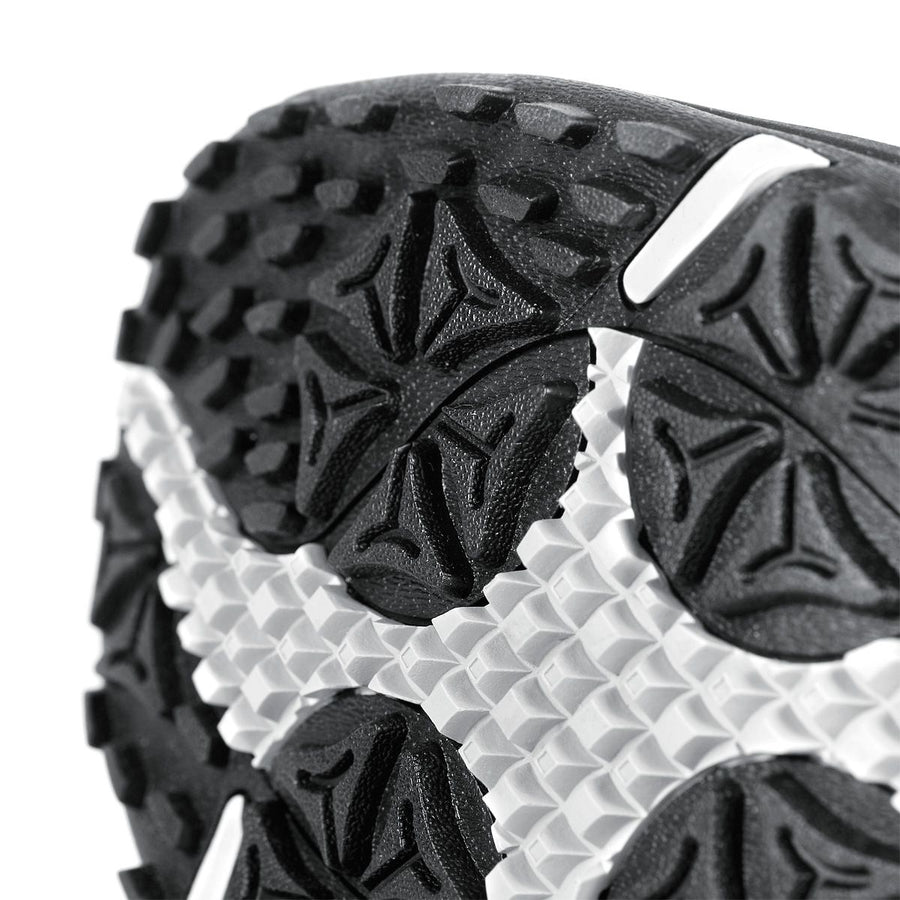 up close view of the sole of a black Orlimar Spikeless Golf Sandal